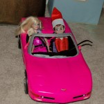 Elf on the Shelf: Riding with Barbie, 2012 Copyright Christine Hull, Windy Pinwheel