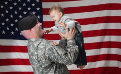 Military Baby Shower: American Soldier holds his infant son, Source: Photodune.net