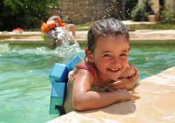 Pool safety: Smiling little girl in a swimming pool, Source: Photodune.net pool safety