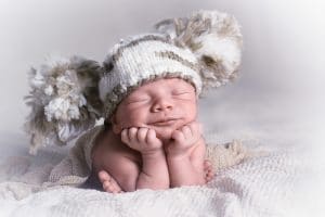 Newborn baby photo with a beanie on its head, Source: Clara Morton, Sleeping Angels Co newborn care specialist